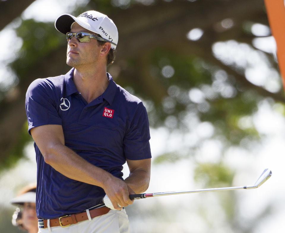 Adam Scott, of Queensland, Australia, watches his drive off the second tee during the fourth round of the Sony Open golf tournament at Waialae Country Club, Sunday, Jan. 12, 2014, in Honolulu. (AP Photo/Eugene Tanner)