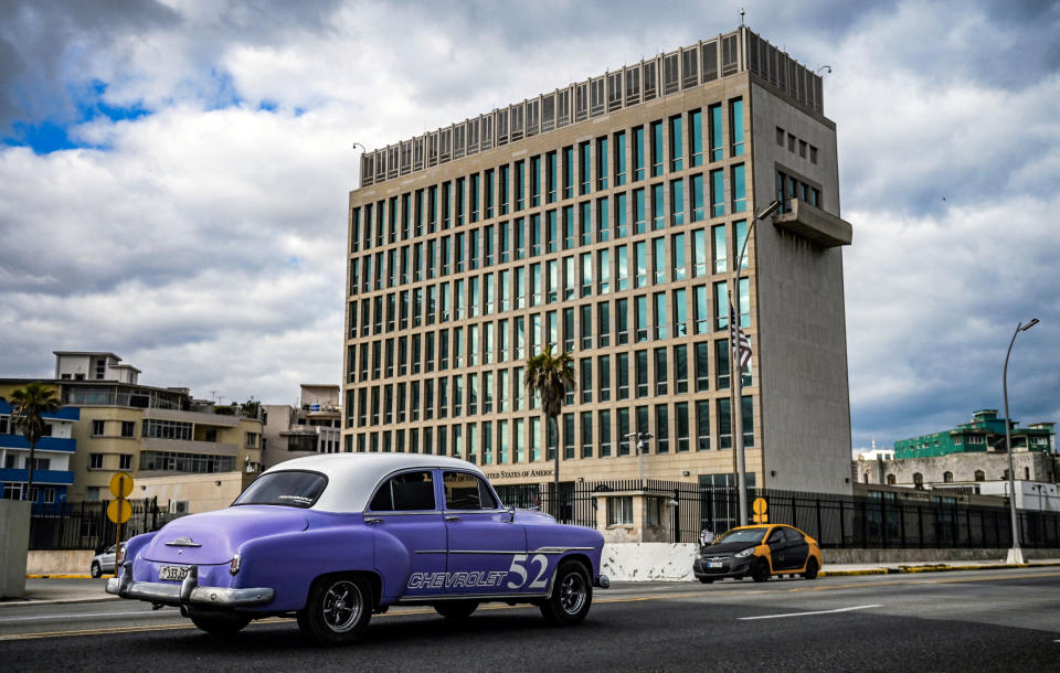 An old American car passes by the U.S. embassy in Havana on May 3, 2022. (Yamil Lage / AFP via Getty Images file)