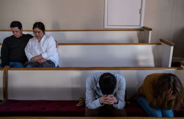 PHOTO: People attend a vigil at Woodmont Christian Church for those who were killed in a mass shooting at the Covenant School in Nashville, Tennessee, on March 27, 2023. (Seth Herald/Getty Images)