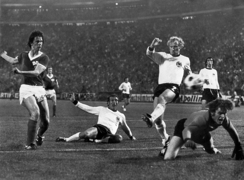 East Germany forward Jürgen Sparwasser evades Horst-Dieter Höttges and Berti Vogts to score the winning goal (AFP via Getty Images)