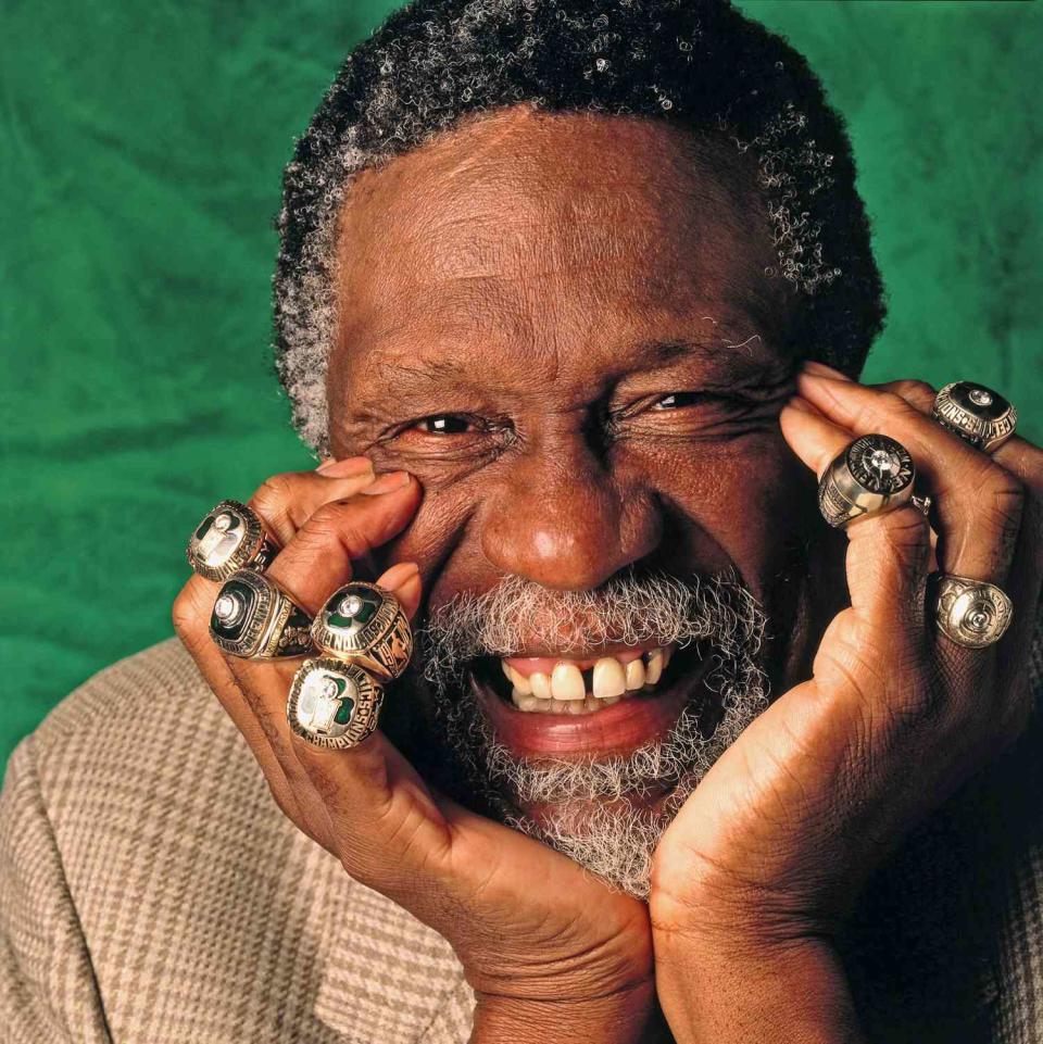 Bill Russell of the Boston Celtics poses for a photo with eleven of his Championship rings in 1996 in Boston, Massachusetts