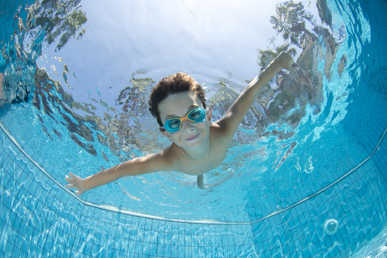 boy underwater in a swimming pool