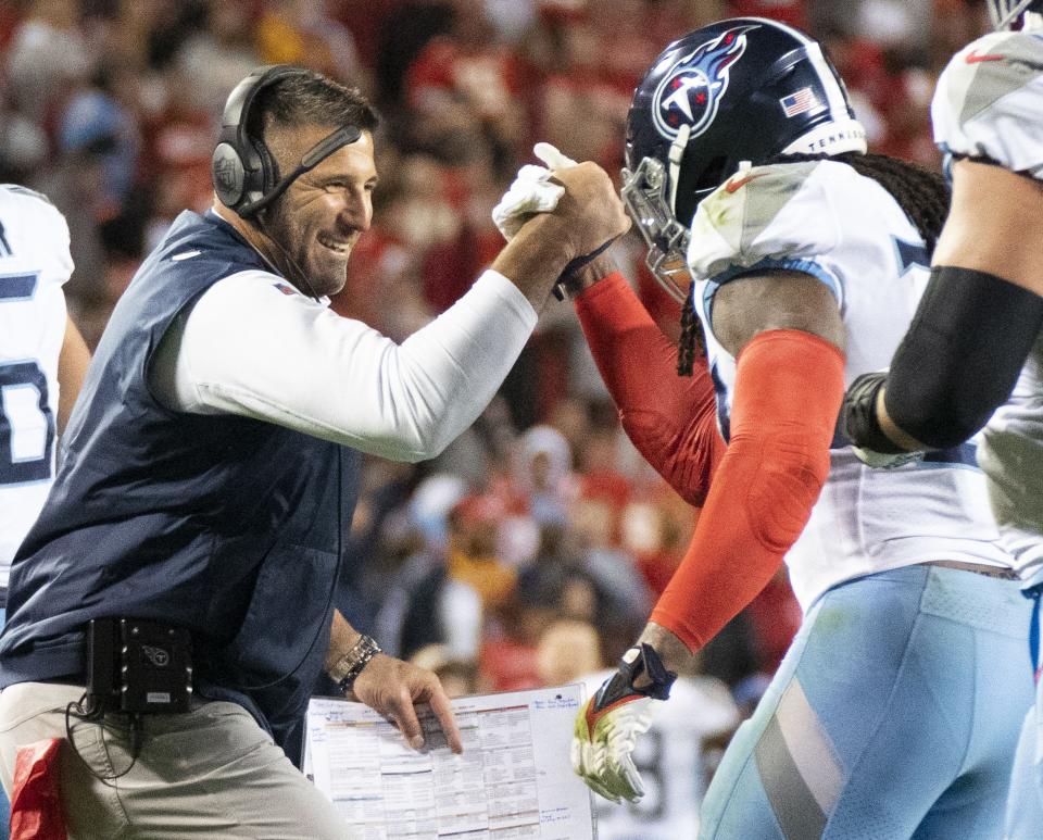 Titans head coach Mike Vrabel congratulates running back Derrick Henry after his second-quarter touchdown against the Chiefs, Nov. 6, 2022, in Kansas City, Mo.