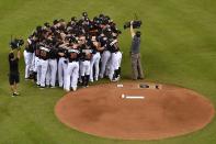 <p>Members of the Miami Marlins gather around the mound to honor fallen teammate starting pitcher Jose Fernandez prior to the game against the New York Mets at Marlins Park. Mandatory Credit: Jasen Vinlove-USA TODAY Sports </p>