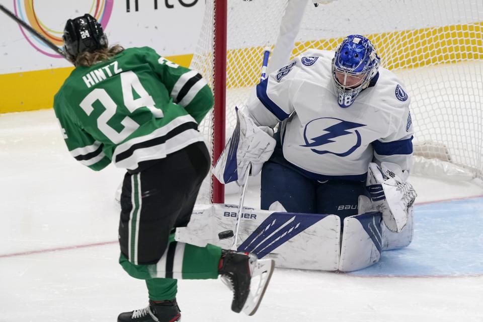 Dallas Stars left wing Roope Hintz (24) has his shot blocked by Tampa Bay Lightning goaltender Andrei Vasilevskiy (88) in the third period of an NHL hockey game in Dallas, Tuesday, March 2, 2021. (AP Photo/Tony Gutierrez)