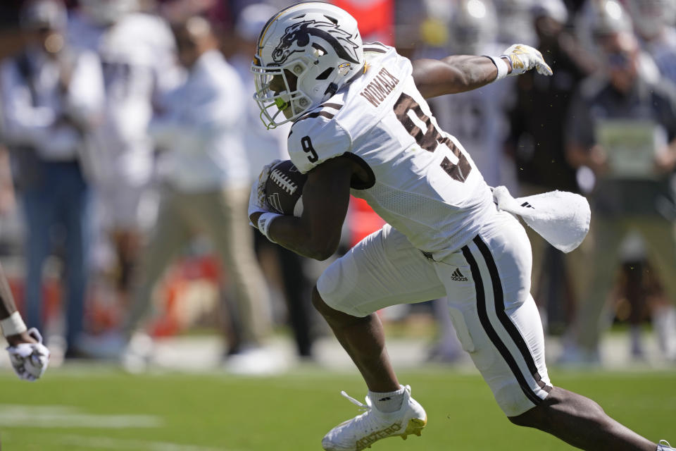 Western Michigan wide receiver Kenneth Womack (9) takes a pass upfield for a first down against Mississippi State during the second half of an NCAA college football game, Saturday, Oct. 7, 2023, in Starkville, Miss. (AP Photo/Rogelio V. Solis)