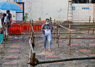 A student wearing a protective face mask arrives at an examination centre for Joint Entrance Examination (JEE), amidst the spread of the coronavirus disease (COVID-19), in Ahmedabad, India, September 1, 2020. REUTERS/Amit Dave