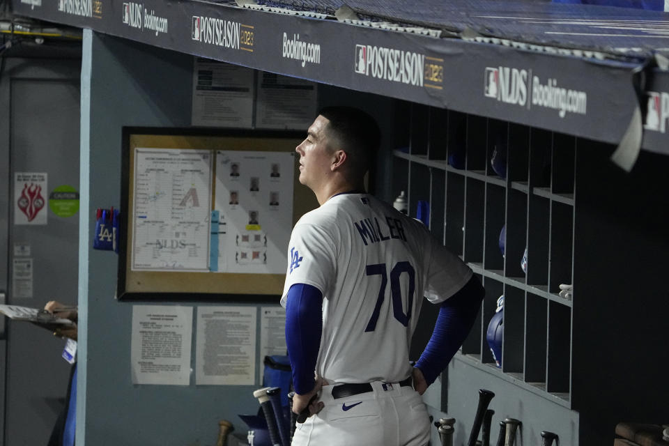 Los Angeles Dodgers starting pitcher Bobby Miller (70) looks on from the dugout after being replaced during the second inning in Game 2 of a baseball NL Division Series against the Arizona Diamondbacks, Monday, Oct. 9, 2023, in Los Angeles. (AP Photo/Mark J. Terrill)