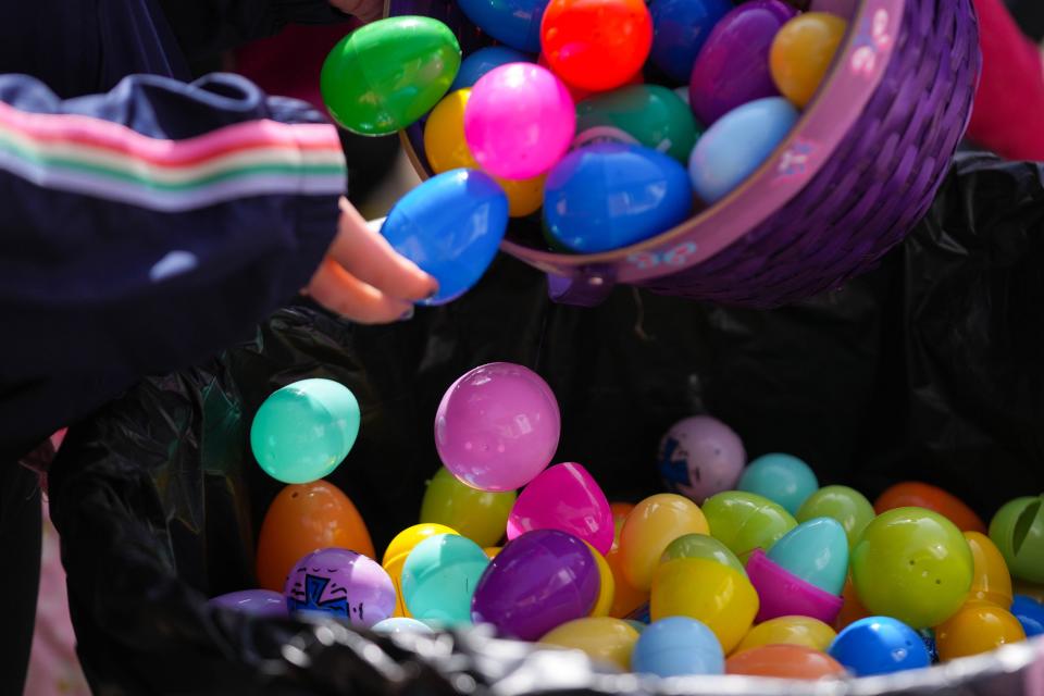 Payton Rice, 8, returns Easter eggs to get a goodie bag during the annual Egg Hunt on the Hill at Iowa Governor's Mansion, Terrace Hill in Des Moines on Saturday, April 1, 2023.