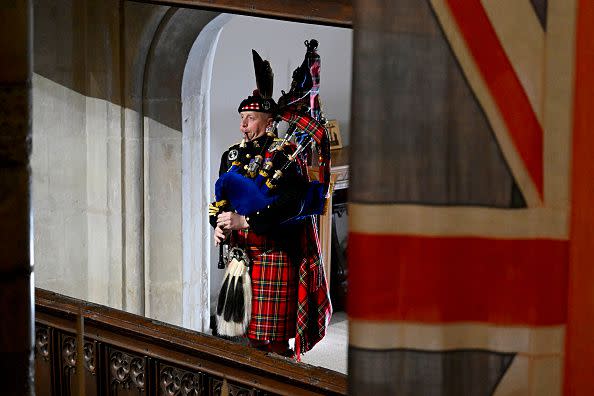 LONDON, ENGLAND - SEPTEMBER 19: Pipe Major Paul Burns of the Royal Regiment of Scotland helps to close Queen Elizabeth II state funeral with a rendition of the traditional piece Sleep, Dearie, Sleep at Westminster Abbey on September 19, 2022 in London, England. Elizabeth Alexandra Mary Windsor was born in Bruton Street, Mayfair, London on 21 April 1926. She married Prince Philip in 1947 and ascended the throne of the United Kingdom and Commonwealth on 6 February 1952 after the death of her Father, King George VI. Queen Elizabeth II died at Balmoral Castle in Scotland on September 8, 2022, and is succeeded by her eldest son, King Charles III.  (Photo by Gareth Cattermole/Getty Images)