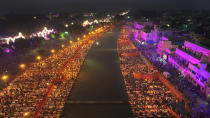 Lamps light up the banks of the river Saryu on the eve of the Hindu festival of Diwali, in Ayodhya, India, Saturday, Nov. 11, 2023. Ayodhya city in the northern Indian state of Uttar Pradesh Saturday set a record by lighting over 2.2 million earthen oil lamps during Deepotsav celebrations on the eve of Diwali, creating a new Guinness World Record for lighting lamps in such a large number, according to state tourism department. (AP Photo/Rajesh Kumar Singh)
