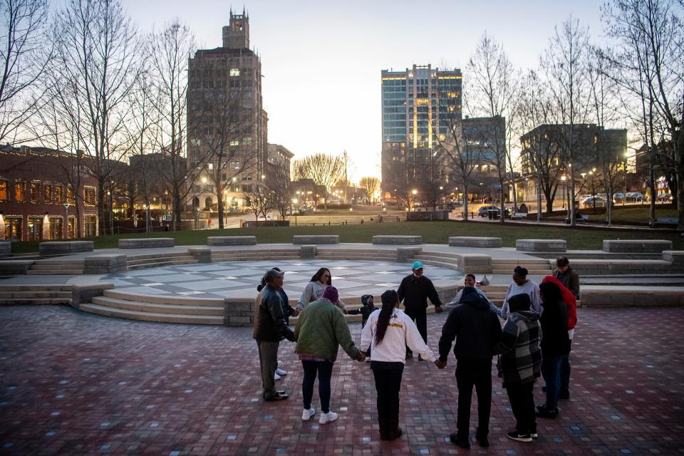 A vigil for peace is held at Pack Square Park, February 2, 2024, in honor of Keith Mosely, who was shot and killed in 2022.