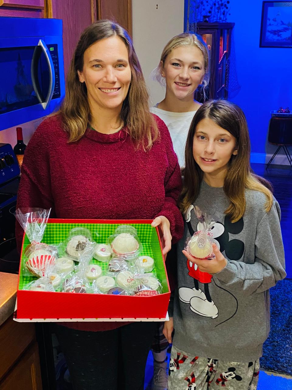 Cheryl Hill (left) and her daughters Hayden (back) and Hannah have made Cheerful Chocolates a success.