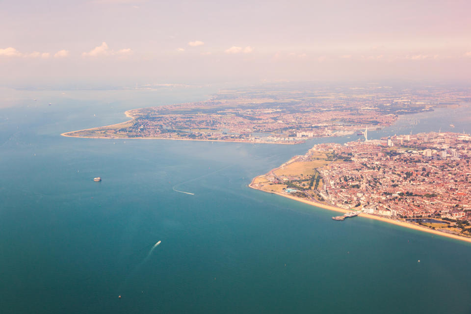 The view, on a hazy day, of Portsmouth and Gosport from an aircraft above the Solent.
