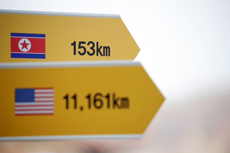 A directional sign bearing North Korean and U.S. flags is seen near the demilitarized zone separating the two Koreas in Paju