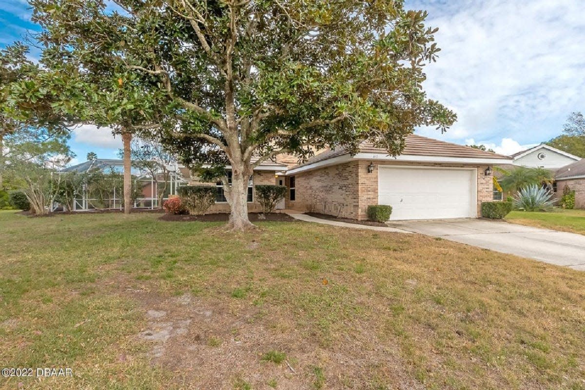 This pool home in the Daytona Beach community of Pelican Bay is ideally situated on a cul-de-sac, with water views out back.