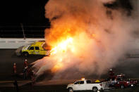 DAYTONA BEACH, FL - FEBRUARY 27: Safety workers try to extinguish a fire from a jet dryer after being hit by Juan Pablo Montoya, driver of the #42 Target Chevrolet, under caution during the NASCAR Sprint Cup Series Daytona 500 at Daytona International Speedway on February 27, 2012 in Daytona Beach, Florida. (Photo by Tom Pennington/Getty Images for NASCAR)