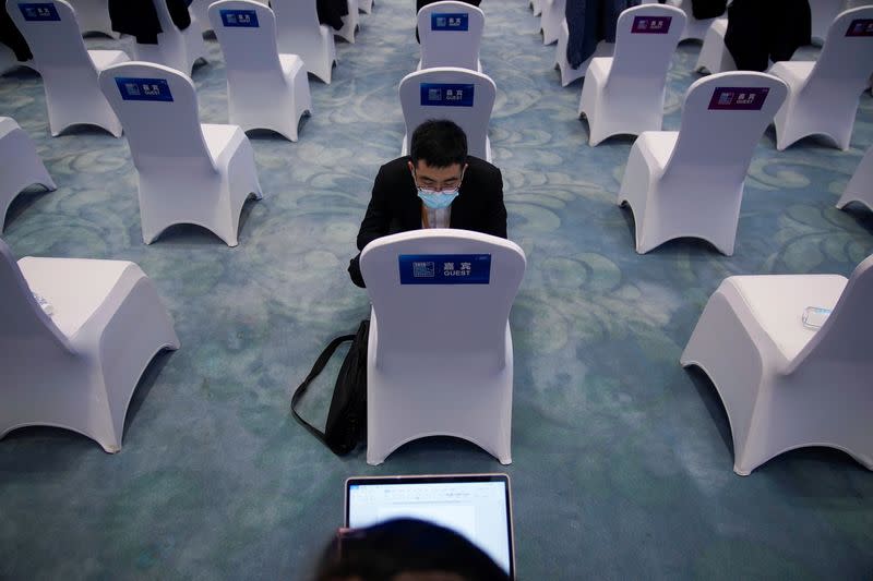 People check laptop at the opening ceremony of the World Internet Conference (WIC) in Wuzhen