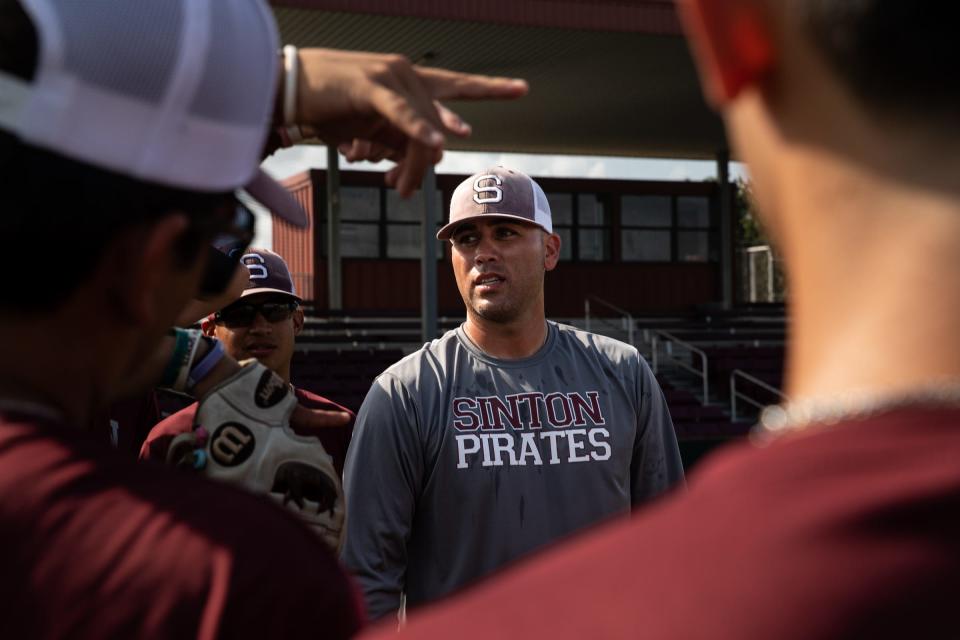 Sinton head baseball coach Adrian Alaniz asked the team which base running drill is their favorite during baseball practice at Gene Kasprzyk Field on Tuesday, May 2, 2023, in Sinton, Texas. 