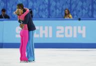 Germany's Aliona Savchenko and Robin Szolkowy celebrate at the end of their program during the Figure Skating Pairs Short Program at the Sochi 2014 Winter Olympics, February 11, 2014. REUTERS/Alexander Demianchuk (RUSSIA - Tags: OLYMPICS SPORT FIGURE SKATING)