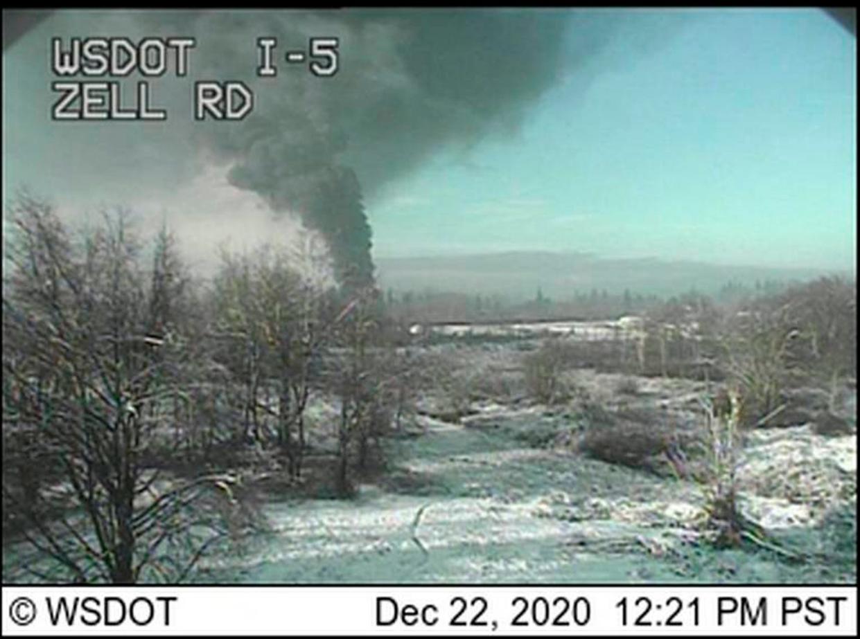 A Washington state Department of Transportation traffic camera captures an image of a train that derailed on Tuesday north of Seattle, near the Canadian border.