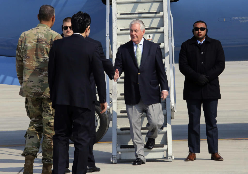 U.S. Secretary of State Rex Tillerson, second from right, is greeted by U.S. officials upon his arrival at Osan Air Base in Pyeongtaek, South Korea, Friday, March 17, 2017. (AP Photo/Ahn Young-joon)