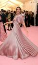 <p>For the <a href="https://www.sheknows.com/entertainment/slideshow/2227843/best-met-gala-behind-the-scenes-photos/" rel="nofollow noopener" target="_blank" data-ylk="slk:2019 Met Gala;elm:context_link;itc:0" class="link ">2019 Met Gala</a> theme of “Camp: Notes on Fashion,” no one could take their eyes off Bundchen in her flowing, pink silk gown from Dior.</p>