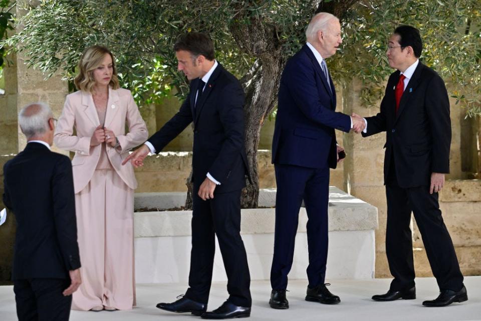 French President Emmanuel Macron, Italian Prime Minister Giorgia Meloni, U.S. President Joe Biden, and Japanese Prime Minister Fumio Kishida at the G7 summit.