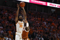 Tennessee guard Josiah-Jordan James (30) shoots over Texas guard Marcus Carr (5) during the first half of an NCAA college basketball game Saturday, Jan. 28, 2023, in Knoxville, Tenn. (AP Photo/Wade Payne)