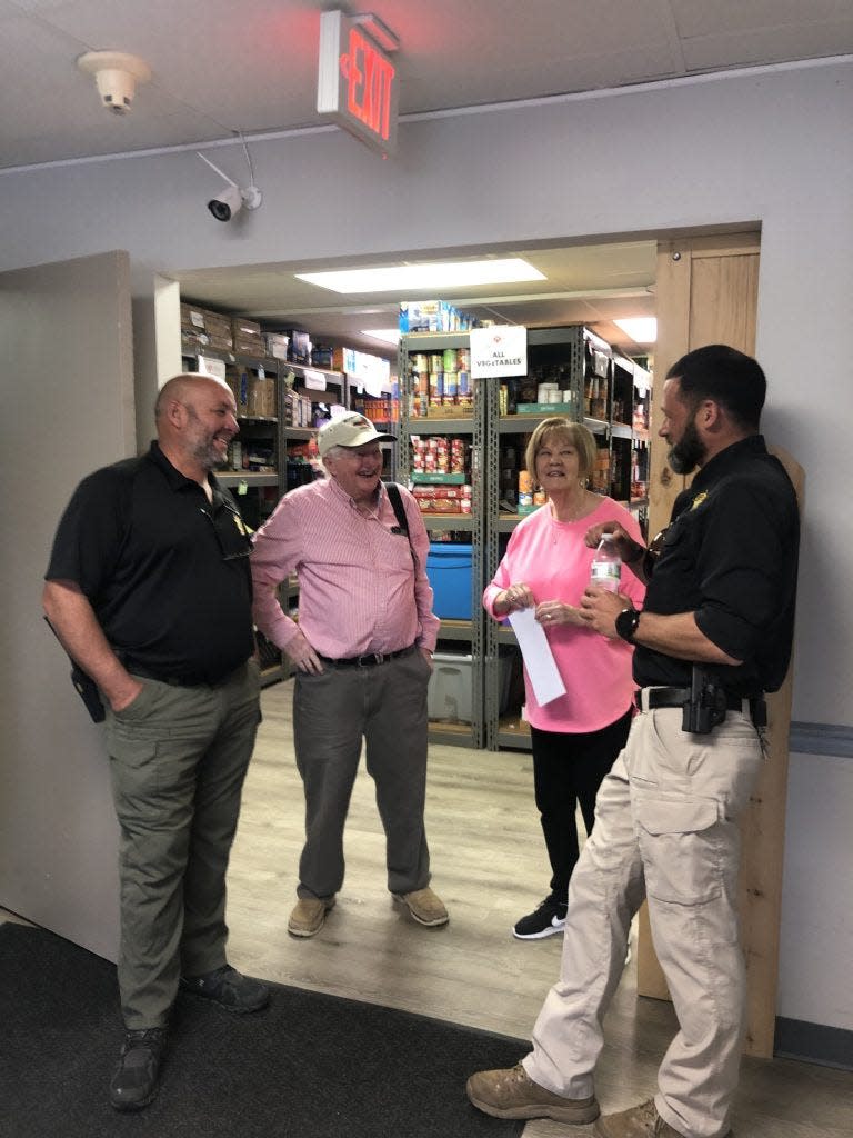 Volunteers at The Filling Station in Pollocksville celebrate receiving Governor's Medallion Award.