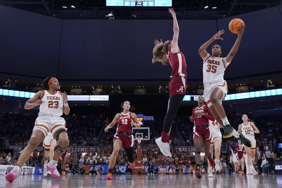 Texas forward Madison Booker (35) drives to the basket against Alabama guard Sarah Ashlee Barker during the first half of a second-round college basketball game in the women’s NCAA Tournament in Austin, Texas, Sunday, March 24, 2024. (AP Photo/Eric Gay)