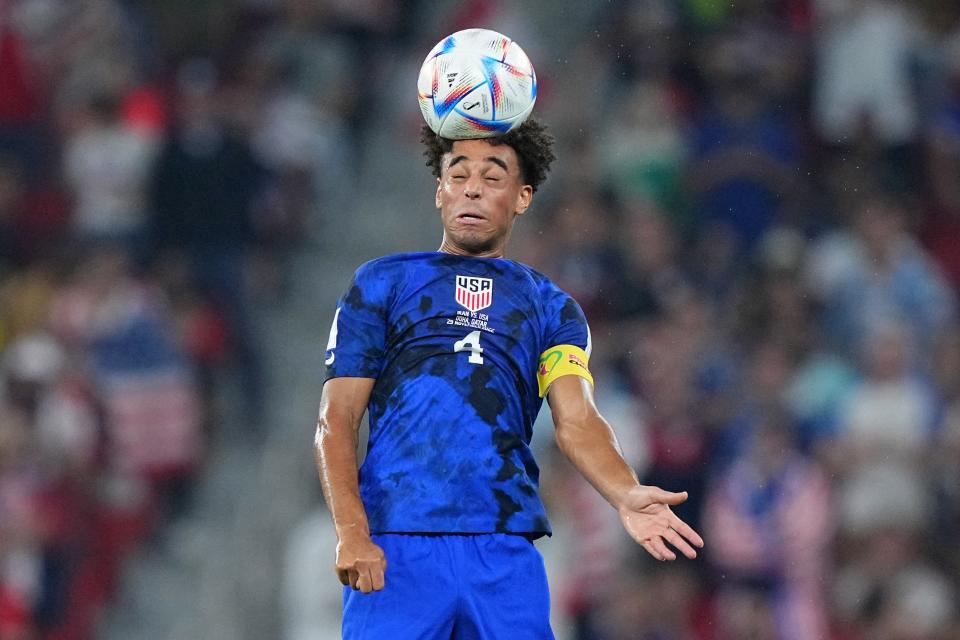 U.S. midfielder Tyler Adams, a Roy C. Ketcham High School graduate, heads the ball against Iran during the first half of a group stage match during the 2022 World Cup at Al Thumama Stadium in Doha, Qatar Tuesday.