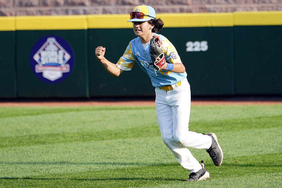 El Segundo, Calif., center fielder Max Baker celebrates after catching the final out of a win over Needville, Texas, in the United States Championship baseball game at the Little League World Series tournament in South Williamsport, Pa., Saturday, Aug. 26, 2023. (AP Photo/Tom E. Puskar)