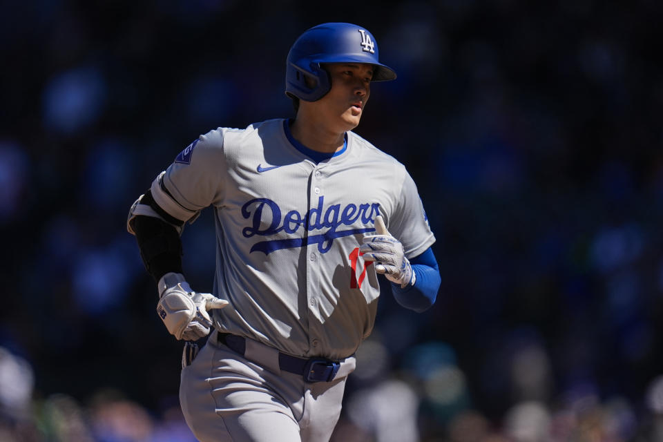 Los Angeles Dodgers' Shohei Ohtani runs the bases after hitting a home run during the fifth inning of a baseball game against the Chicago Cubs, Friday, April 5, 2024, in Chicago. (AP Photo/Erin Hooley)