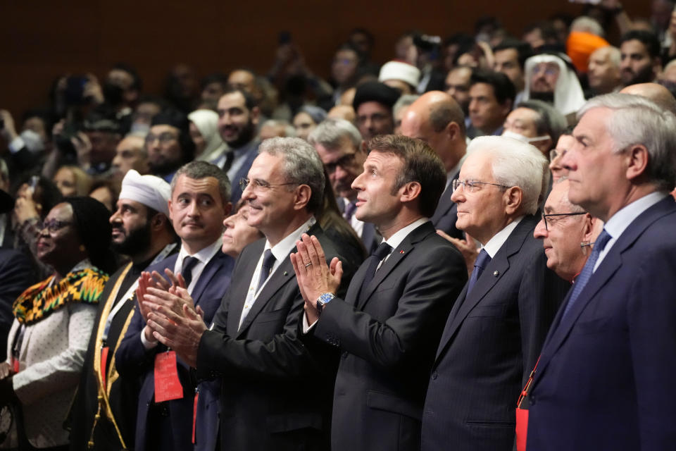 French President Emmanuel Macron, fourth right, is flanked at right by Italian president Sergio Mattarella as they arrive at "Cry for peace" an international conference for peace organized by the Community of Sant'Egidio in Rome, Sunday, Oct. 23, 2022. (AP Photo/Alessandra Tarantino)
