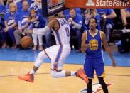 May 22, 2016; Oklahoma City, OK, USA; Oklahoma City Thunder guard Russell Westbrook (0) dunks past Golden State Warriors guard Shaun Livingston (34) during the second quarter in game three of the Western conference finals of the NBA Playoffs at Chesapeake Energy Arena. Mandatory Credit: Mark D. Smith-USA TODAY Sports