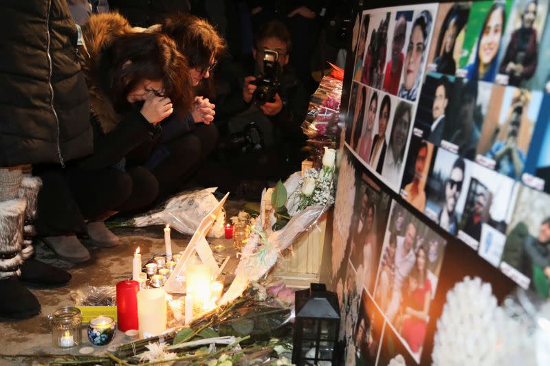 FILE PHOTO: Mourners attend an outdoor vigil for the victims of a Ukrainian passenger jet which crashed in Iran, in Toronto