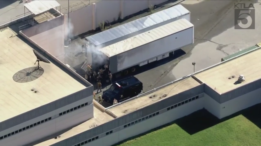 Officials respond to a smoking trailer after a training accident at a correctional facility in Castaic on Oct. 10, 2023. (KTLA)