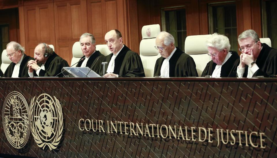 Judges from left: Mohamed Bennouna, Ronny Abraham, vice president Bernardo Sepulveda-Amor, president Peter Tomka, Hisashi Owada, Kenneth Keith and Leonid Skotnikov prior to the start of public hearings at the International Court of Justice (ICJ) in The Hague, Netherlands, Monday, March 3, 2014. Croatia is accusing Serbia of genocide during fighting in the early 1990's as the former Yugoslavia shattered in spasms of ethnic violence, in a case at the United Nations' highest court that highlights lingering animosity in the region. Croatia is asking the ICJ to declare that Serbia breached the 1948 Genocide Convention when forces from the former Federal Republic of Yugoslavia attempted to drive Croats out of large swaths of the country after Zagreb declared independence in 1991. (AP Photo/Jiri Buller)