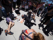 <p>People stage a “die-in” during a rally in favor of single-payer healthcare for all Californians as the US Senate prepares to vote on the Senate GOP health care bill, outside the office of California Assembly Speaker Anthony Rendon, June 27, 2017 in South Gate, Calif. (Photo: Robyn Beck/AFP/Getty Images) </p>