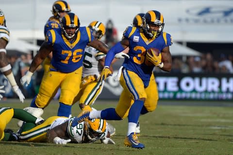 Los Angeles Rams running back Todd Gurley (30) runs during the fourth quarter against the Green Bay Packers - Credit: Jake Roth/USA Today