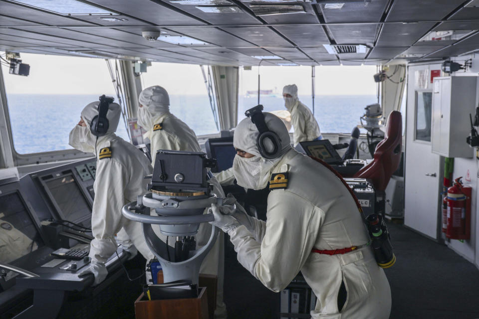 In this photo provided by the Ministry of Defence (MoD), members of the HMS Diamond's Bridge team shoot down a missile fired by the Iranian-backed Houthis from Yemen, Wednesday, April 24, 2024. Yemen’s Houthi rebels fired a large barrage of drones and missiles targeting shipping in the Red Sea Wednesday. (LPhot Chris Sellars/MoD Crown via AP)