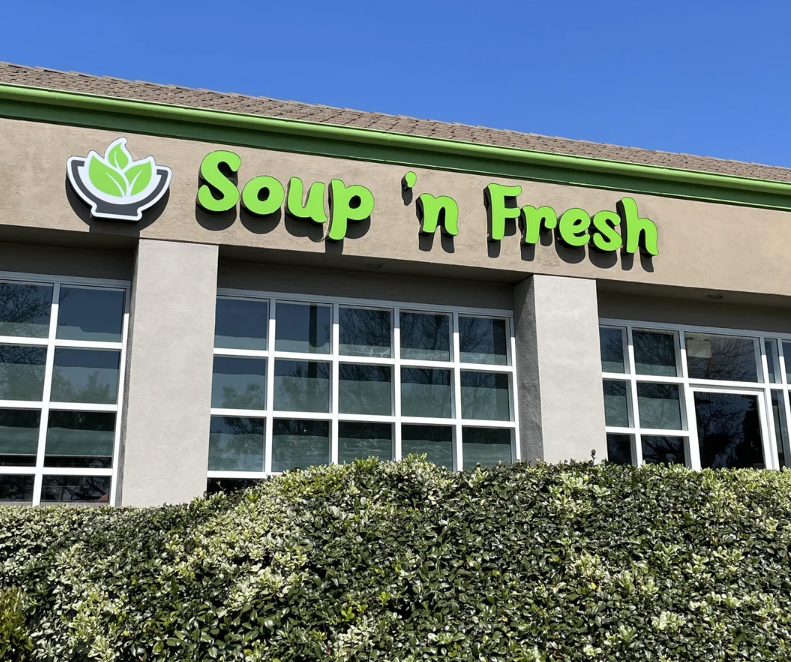 Storefront of 'Soup n' Fresh' with a green sign above the entrance