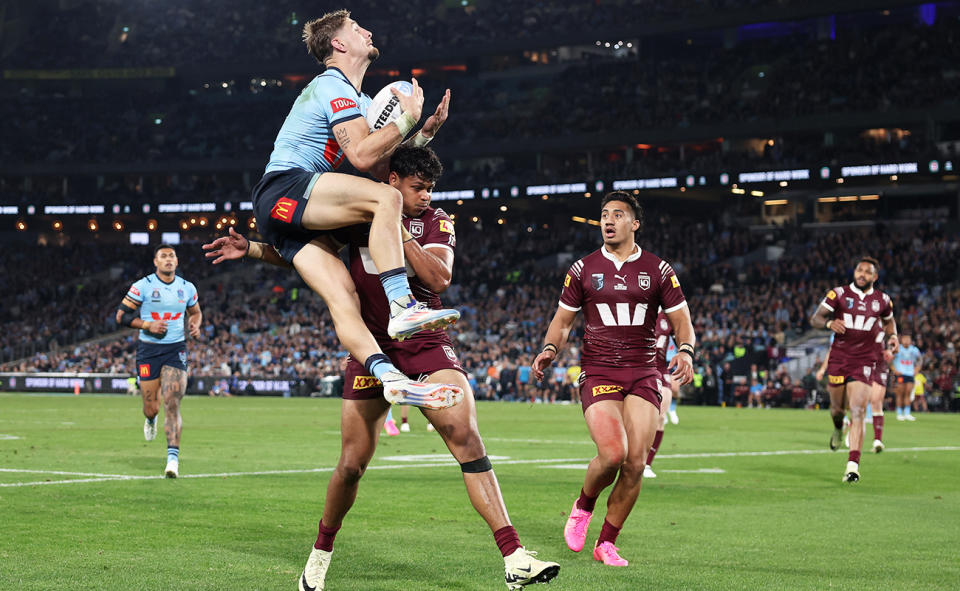 Zac Lomax, pictured here leaping above Selwyn Cobbo to score the second try for NSW.