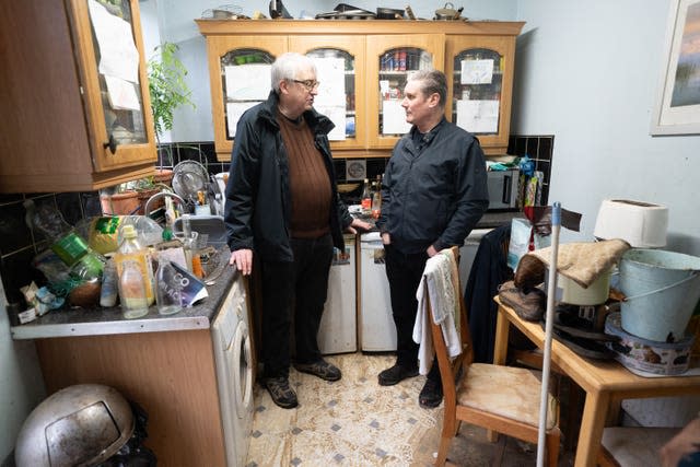 Labour Party leader Sir Keir Starmer meets Ian Clement, whose house in Loughborough, East Midlands, flooded during Storm Henk, on Monday