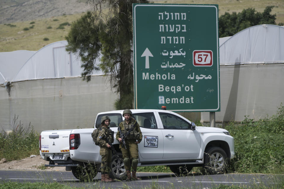 Israeli soldiers set up a roadblock following a shooting attack near the Israeli settlement of Hamra in West Bank at the Jordan Valley, Friday, April 7, 2023. Israeli medics say an alleged Palestinian shooting attack in the northern West Bank killed two women and seriously wounded another. The Israeli military said security forces were searching for the attacker. (AP Photo/Nasser Nasser)