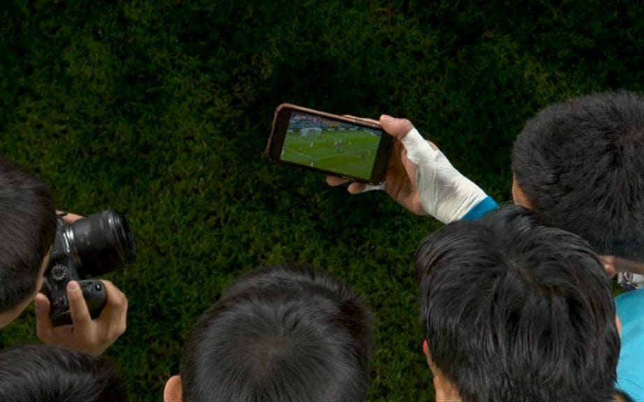 South Korea players watch on tenterhooks waiting for the final whistle in Ghana v Uruguay