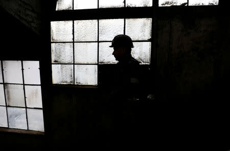 Miner Krzysztof Zawisza, 32 walks inside the Wieczorek mine in Nikiszowiec district in Katowice, Poland, November 26, 2018. REUTERS/Kacper Pempel