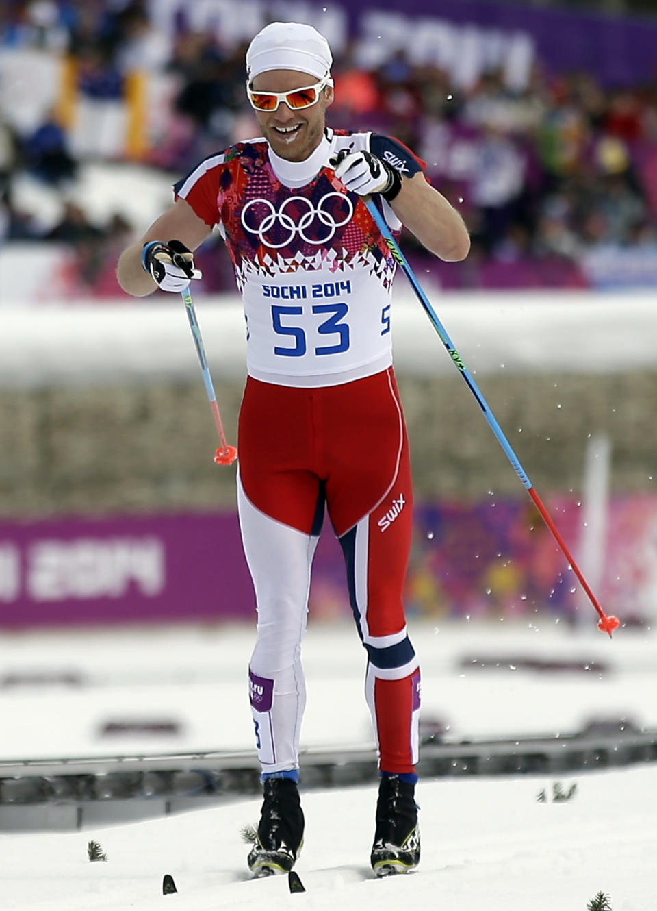 Norway's Martin Johnsrud Sundby competes with his sleeves cut, during the men's 15K classical-style cross-country race at the 2014 Winter Olympics, Friday, Feb. 14, 2014, in Krasnaya Polyana, Russia. (AP Photo/Gregorio Borgia)