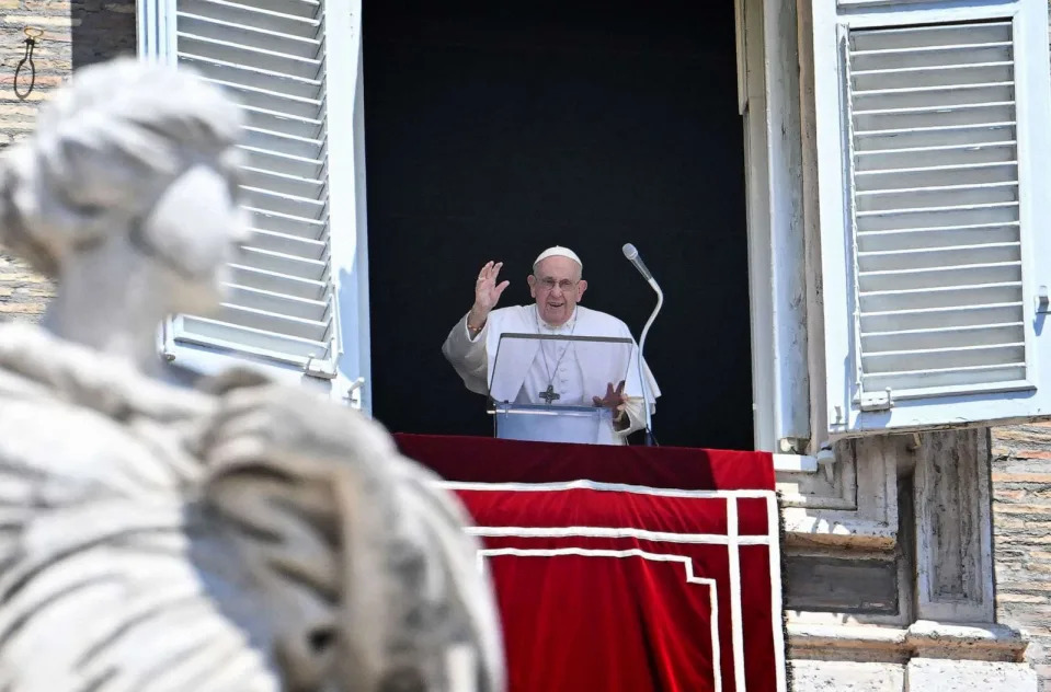 PHOTO: Pope Francis waves as he addresses the crowd from the window of the apostolic palace overlooking St.Peter's square during his Angelus prayer at the Vatican on July 9, 2023. (Alberto Pizzoli/AFP via Getty Images)